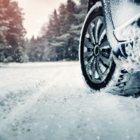 Car tires on winter road